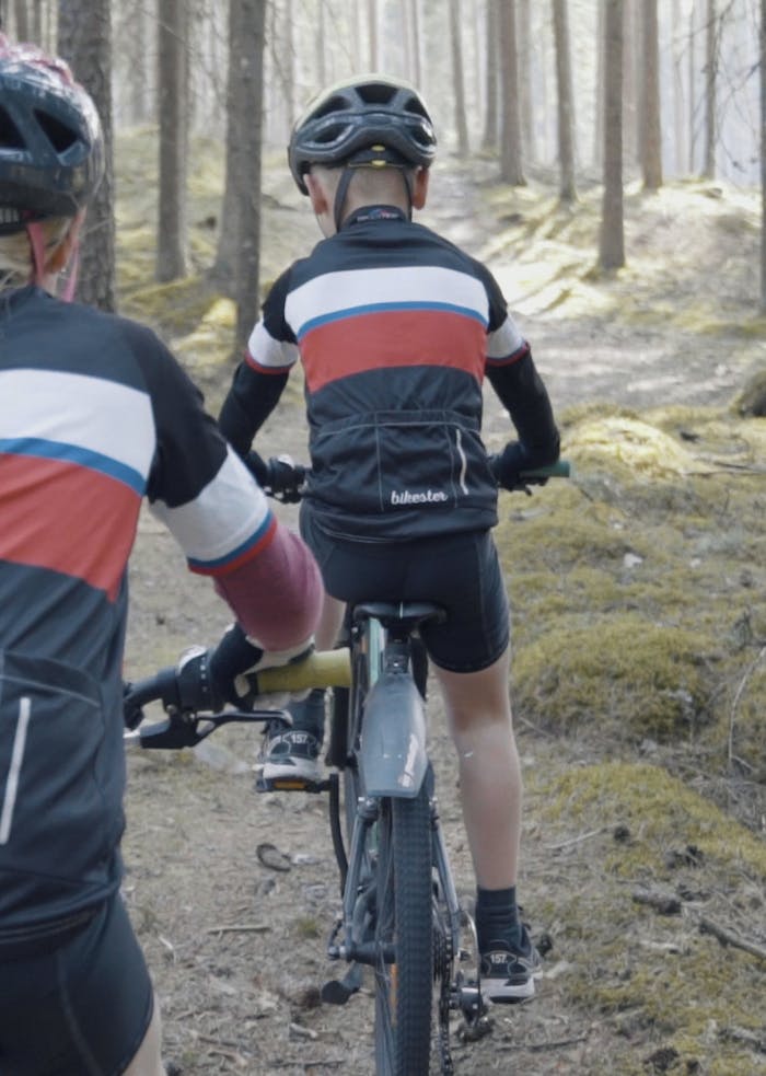 Kids riding bikes wearing bike gloves