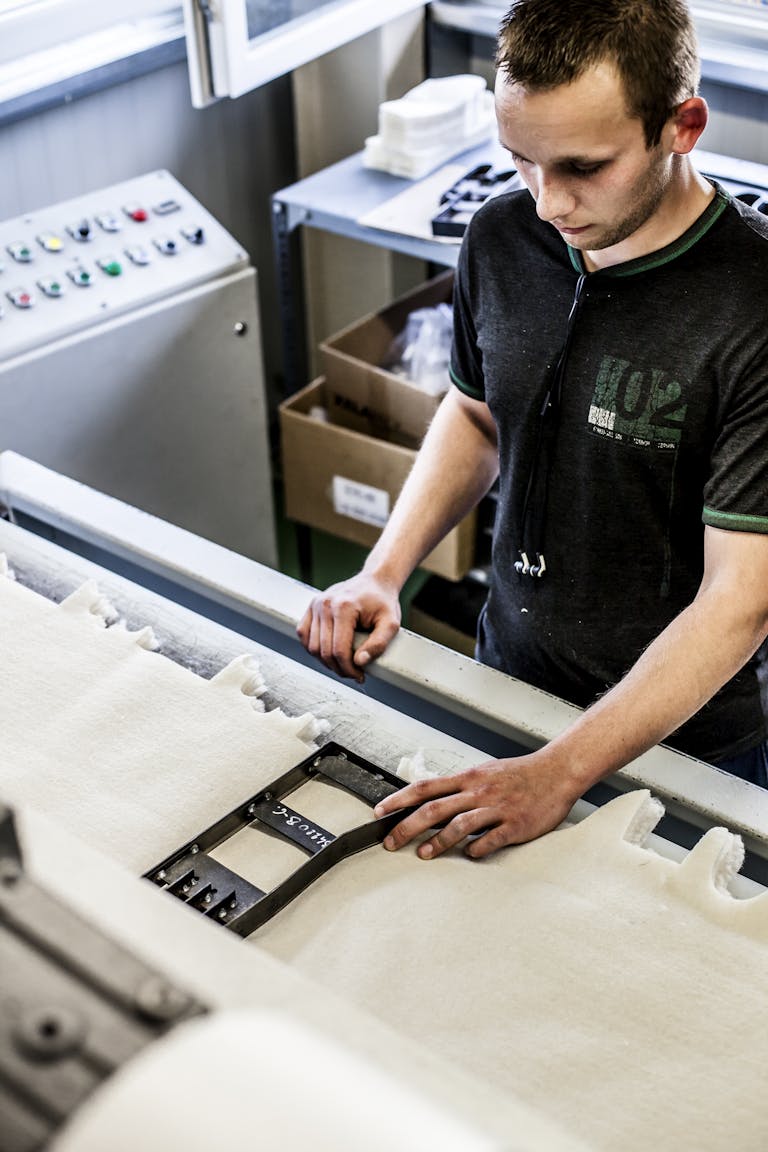 _MG_3488 A man works on handling materials in a factory