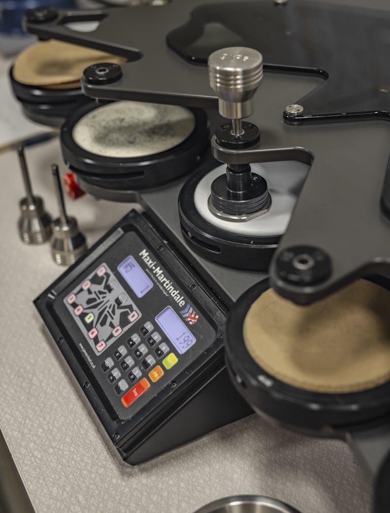 _D5A3474 Machine used for testing and processing materials in the glove workshop